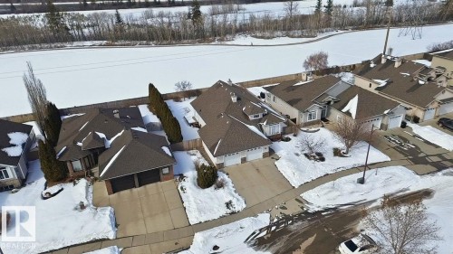 Residential properties featuring private driveways, attached garages, and fenced backyards - 30 Valleyview Ridge, Fort Saskatchewan, AB - Outdoor