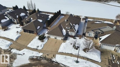 Expansive residence featuring a multi-gabled roofline, a two-car garage, and a concrete driveway - 30 Valleyview Ridge, Fort Saskatchewan, AB - Outdoor
