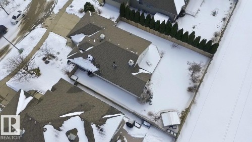 Aerial perspective showcasing a property with a gabled roofline and an expansive backyard - 30 Valleyview Ridge, Fort Saskatchewan, AB - Outdoor With View