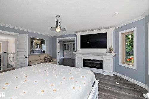 19 Oak Point, St. Albert, AB - Indoor Photo Showing Bedroom With Fireplace