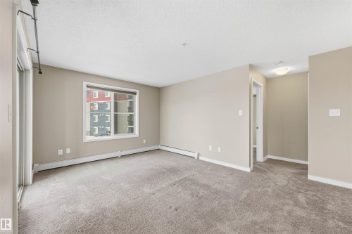 221 1070 Mcconachie Boulevard, Edmonton, AB - Indoor Photo Showing Living Room
