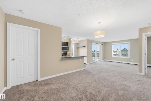 221 1070 Mcconachie Boulevard, Edmonton, AB - Indoor Photo Showing Kitchen With Double Sink