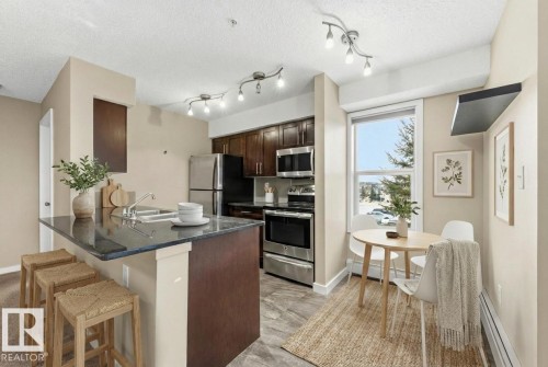 221 1070 Mcconachie Boulevard, Edmonton, AB - Indoor Photo Showing Kitchen With Stainless Steel Kitchen With Double Sink
