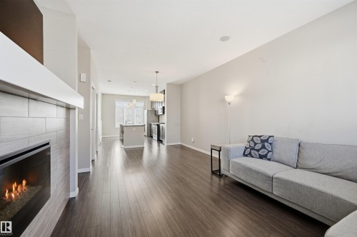 4 320 Secord Boulevard, Edmonton, AB - Indoor Photo Showing Living Room With Fireplace