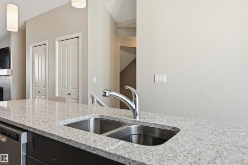 4 320 Secord Boulevard, Edmonton, AB - Indoor Photo Showing Kitchen With Double Sink