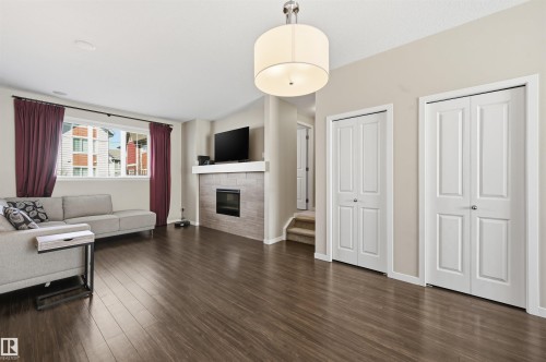 4 320 Secord Boulevard, Edmonton, AB - Indoor Photo Showing Living Room With Fireplace