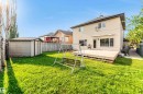 Expansive backyard featuring a manicured lawn, a detached storage shed, and mature trees - 10621 175A Avenue, Edmonton, AB  - Outdoor 
