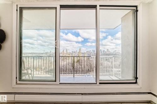 Sliding glass doors opening to an outdoor balcony - 405 10135 Saskatchewan Drive Nw, Edmonton, AB - Indoor Photo Showing Other Room