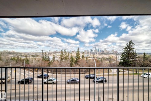 Expansive cityscape panorama from a private balcony, featuring a black metal railing - 405 10135 Saskatchewan Drive Nw, Edmonton, AB - Outdoor With View