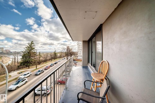 Private balcony featuring a metal railing, concrete flooring, and sliding glass doors - 405 10135 Saskatchewan Drive Nw, Edmonton, AB - Outdoor