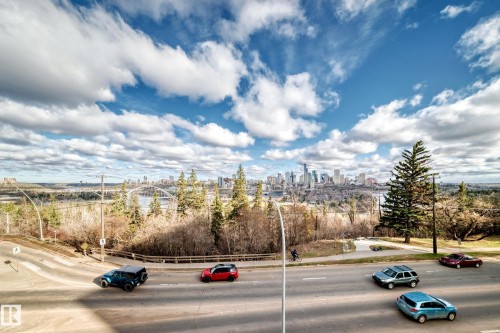 Expansive urban skyline featuring multiple high-rise buildings and riverfront architecture - 405 10135 Saskatchewan Drive Nw, Edmonton, AB - Outdoor With View