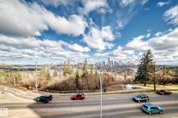 Expansive urban skyline featuring multiple high-rise buildings and riverfront architecture - 