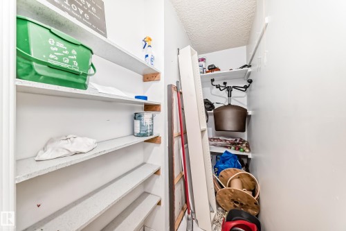 Recessed shelving unit with multiple white shelves, providing vertical storage solutions - 405 10135 Saskatchewan Drive Nw, Edmonton, AB - Indoor