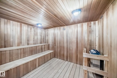 Wood-paneled sauna featuring tiered seating, built-in heater, and overhead lighting - 405 10135 Saskatchewan Drive Nw, Edmonton, AB - Indoor Photo Showing Other Room