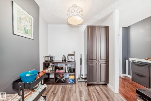 Wood-finish flooring throughout - 601 10135 Saskatchewan Drive Nw, Edmonton, AB - Indoor