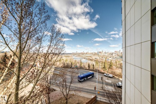 Urban landscape featuring a distant cityscape, a river, and a bridge under a bright sky - 601 10135 Saskatchewan Drive Nw, Edmonton, AB - Outdoor