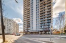 Multi-story building featuring multiple private balconies, a ground-level entrance with prominent signage, and a paved street frontage - 601 10135 Saskatchewan Drive Nw, Edmonton, AB  - Outdoor With Facade 