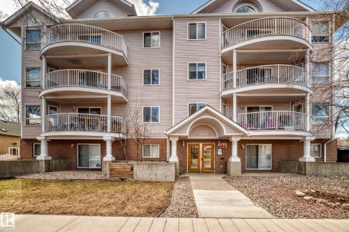 Multi-story residential building featuring light-colored siding and brick accents - 101 10827 85 Avenue Nw, Edmonton, AB - Outdoor With Facade