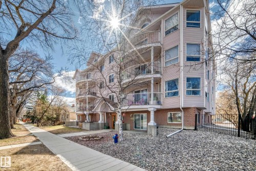 Multi-story building featuring light-toned siding and brick accents - 101 10827 85 Avenue Nw, Edmonton, AB - Outdoor With Facade