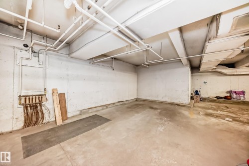 Concrete flooring and white walls in an unfinished basement space - 101 10827 85 Avenue Nw, Edmonton, AB - Indoor Photo Showing Garage