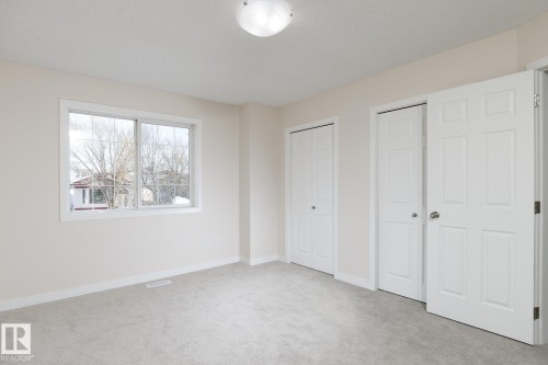 Neutral-toned carpeting and walls provide a versatile foundation - 55 14603 Miller Boulevard, Edmonton, AB - Indoor