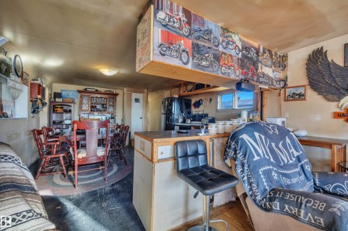 Bar featuring freestanding refrigerator - 21 Calmar Mobile Home Park, Calmar, AB - Indoor