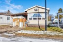 View of front facade with a sunroom - 21 Calmar Mobile Home Park, Calmar, AB  - Outdoor 