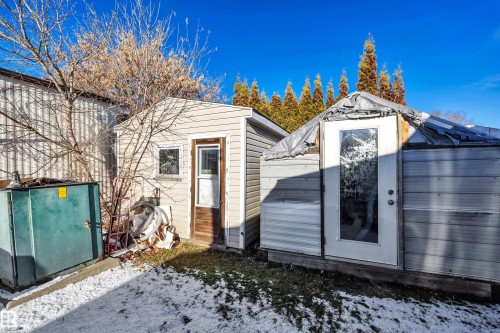 Snow covered structure with a storage unit - 21 Calmar Mobile Home Park, Calmar, AB - Outdoor