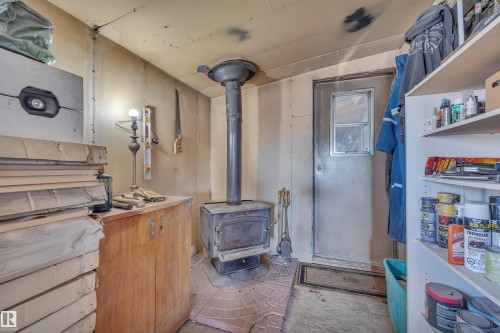 Miscellaneous room with a wood stove - 21 Calmar Mobile Home Park, Calmar, AB - Indoor