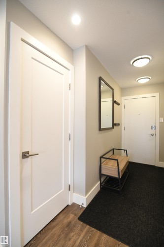 Many condos lack a proper entrance and storage.  Not this unit.  A formal entryway with double closet, and storage, keep your living and entertaining space inviting and organized - 206 8125 110 Street, Edmonton, AB - Indoor Photo Showing Other Room