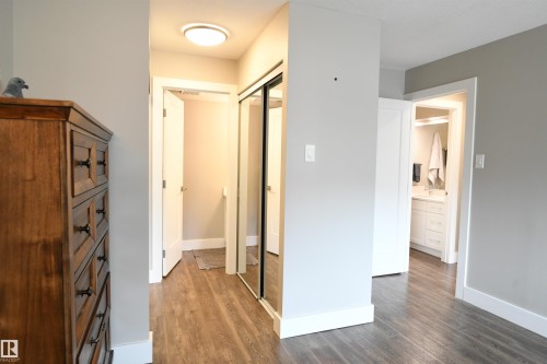 The master suite will easily support king sized furniture, and has a double walk through closet, as well as a spa quality 4 piece ensuite with tile, and contemporary finishes.  This bedroom is a welcome treat - 206 8125 110 Street, Edmonton, AB - Indoor Photo Showing Other Room