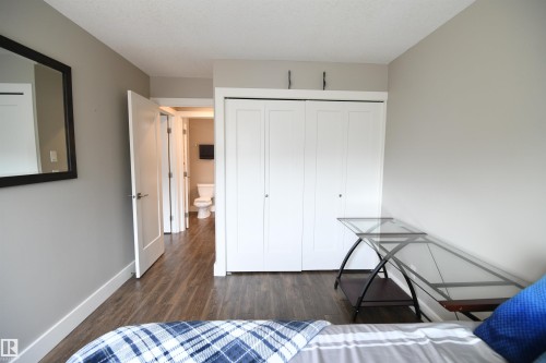 The second bedroom is also nicely sized, with extra room for a desk.  This setup is perfect for an active lifestyle or university life.  Nice closet size in this room as well - 206 8125 110 Street, Edmonton, AB - Indoor Photo Showing Bedroom