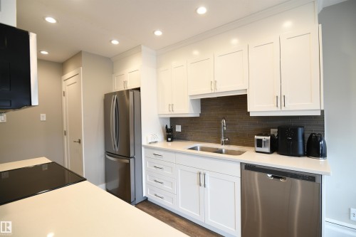 Absolutely stunning renovations throughout this large 2 bedroom condo, with a private balcony, just steps to the UofA campus and hospital.  Absolutely turnkey, with 2 covered parking stalls, and immediate possession available - 206 8125 110 Street, Edmonton, AB - Indoor Photo Showing Kitchen With Double Sink
