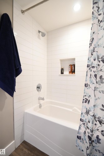 The master ensuite is very nicely appointed, with a full soaker tub, surround, tile accents, and the same high level of fit an finish found in the rest of the unit.  Gorgeous - 206 8125 110 Street, Edmonton, AB - Indoor Photo Showing Bathroom