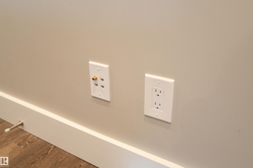 Many of us rely on wireless communications these days, but some folks still need more connectivity options.  During the extensive renovation to the unit, a comprehensive data network was wired in.  If you need it, it's here - 206 8125 110 Street, Edmonton, AB - Indoor Photo Showing Other Room