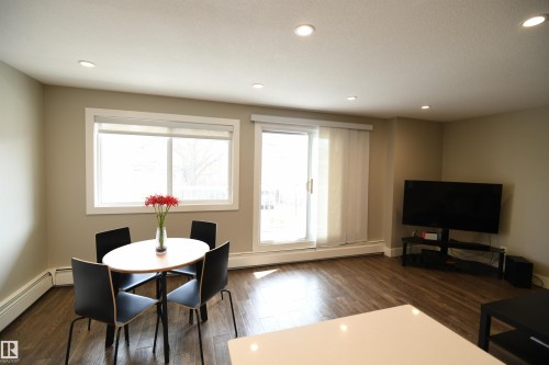 The south wall of glass brings in great natural light, and the patio doors lead to a generously sized private balcony.  A complete window covering package has also been installed, giving you control and options - 206 8125 110 Street, Edmonton, AB - Indoor