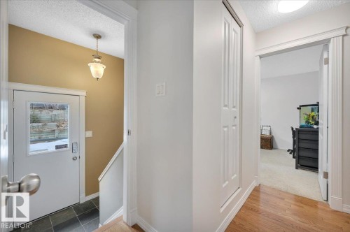 Back entry with tiled flooring leading to the basement - 705 Riddell Street, Edmonton, AB - Indoor Photo Showing Other Room