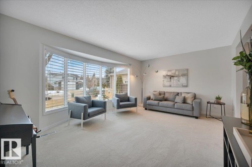 with large bay window - 705 Riddell Street, Edmonton, AB - Indoor Photo Showing Living Room