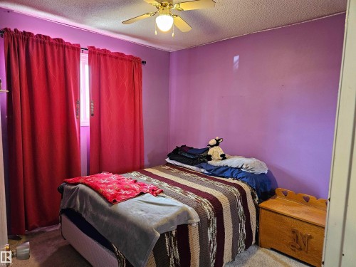 2 of 3 on main floor - 4706 44 Avenue, St. Paul Town, AB - Indoor Photo Showing Bedroom