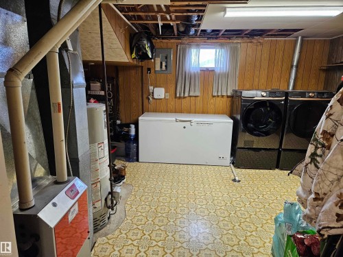 Please Note - the washer and dryer shown in this picture do not stay, there will be a good white color washer and dryer included instead. - 4706 44 Avenue, St. Paul Town, AB - Indoor Photo Showing Laundry Room