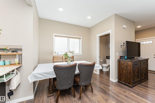 Dining area featuring wood-finish flooring and recessed lighting - 4452 Annett Common, Edmonton, AB 