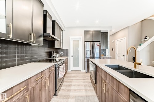 143 Larch Crescent, Leduc, AB - Indoor Photo Showing Kitchen With Double Sink With Upgraded Kitchen