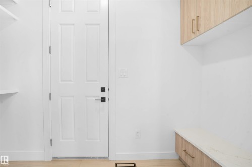 White paneled door with matte black hardware - 22139 81 Avenue, Edmonton, AB - Indoor Photo Showing Other Room