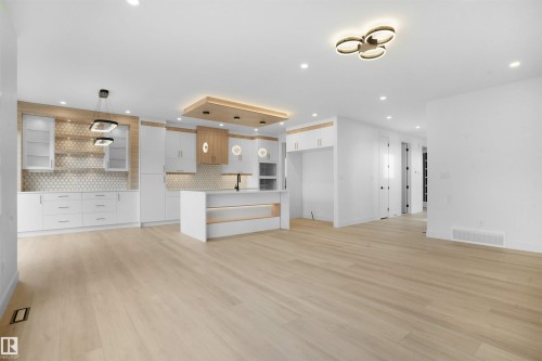Open-concept living space with light wood-finish flooring - 22139 81 Avenue, Edmonton, AB - Indoor Photo Showing Kitchen