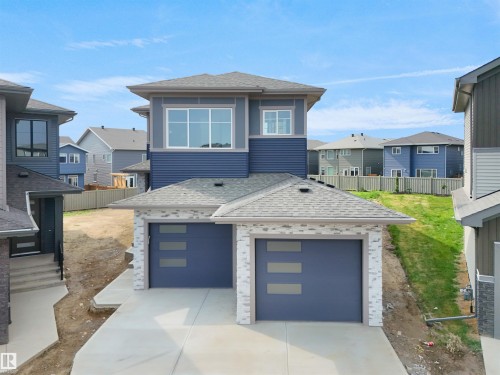 Contemporary home featuring a dual garage with frosted panel inserts - 22139 81 Avenue, Edmonton, AB - Outdoor