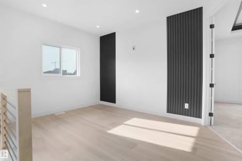 Open concept room featuring light wood-finish flooring and recessed lighting - 22139 81 Avenue, Edmonton, AB - Indoor Photo Showing Other Room