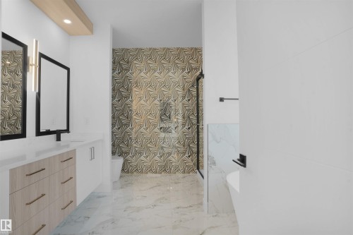 Bathroom featuring a dual vanity with light wood-finish cabinetry, white countertops, and contemporary rectangular mirrors - 22139 81 Avenue, Edmonton, AB - Indoor Photo Showing Other Room