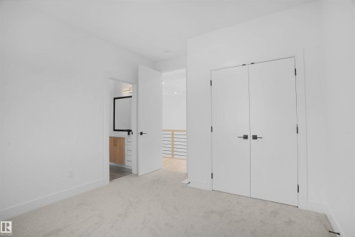 Plush carpeting, crisp white walls, and a recessed ceiling light create a bright space - 22139 81 Avenue, Edmonton, AB - Indoor Photo Showing Other Room