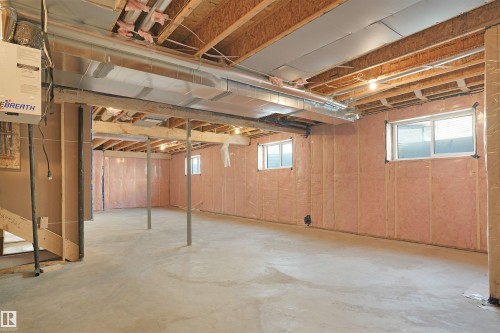 Expansive unfinished basement featuring concrete flooring, exposed wood joists, and insulated walls - 22139 81 Avenue, Edmonton, AB - Indoor Photo Showing Basement