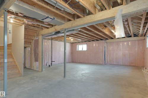 Expansive unfinished basement featuring concrete flooring, exposed wood joists, and insulated walls - 22139 81 Avenue, Edmonton, AB - Indoor Photo Showing Basement